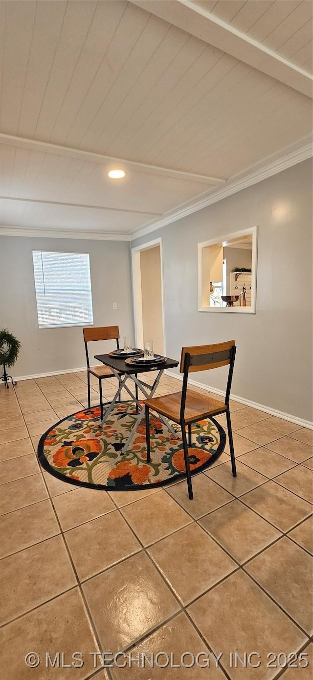 dining area with beam ceiling, tile patterned flooring, and ornamental molding