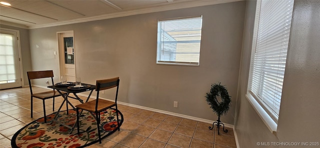 tiled dining space with plenty of natural light and crown molding