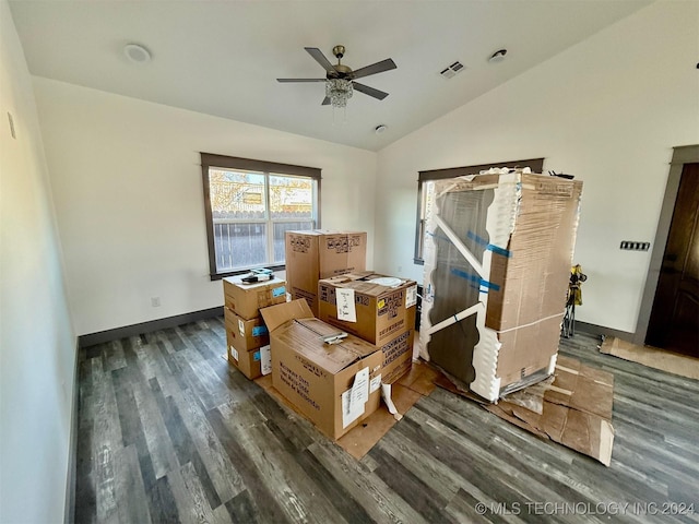 misc room featuring vaulted ceiling, ceiling fan, and dark wood-type flooring