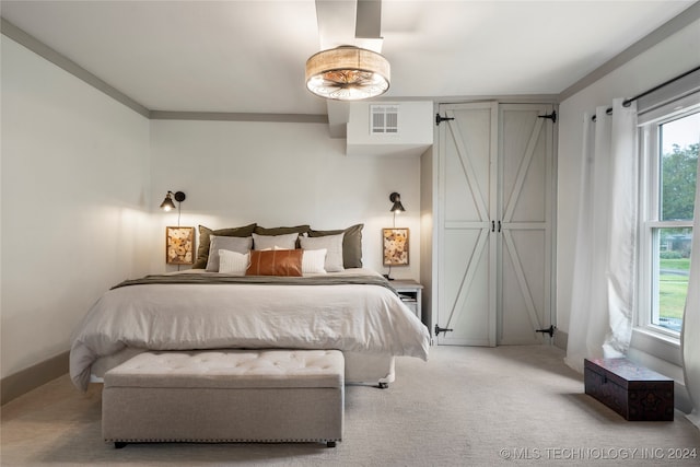 bedroom featuring light colored carpet and crown molding