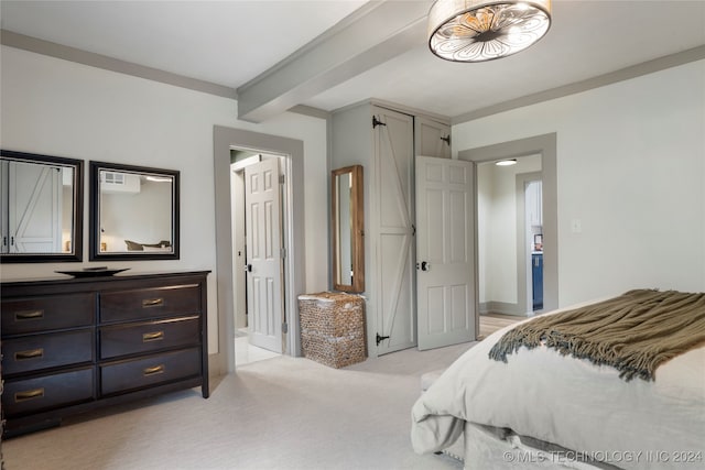 bedroom with beam ceiling and light colored carpet