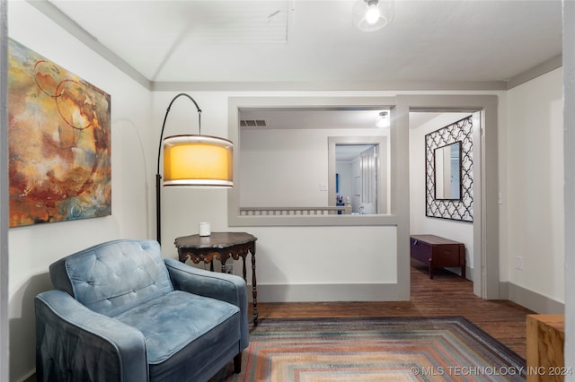 sitting room featuring hardwood / wood-style floors