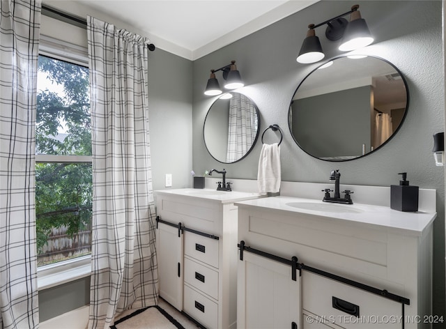 bathroom with vanity and a healthy amount of sunlight