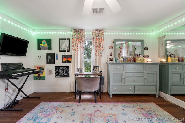 interior space featuring ceiling fan and dark wood-type flooring