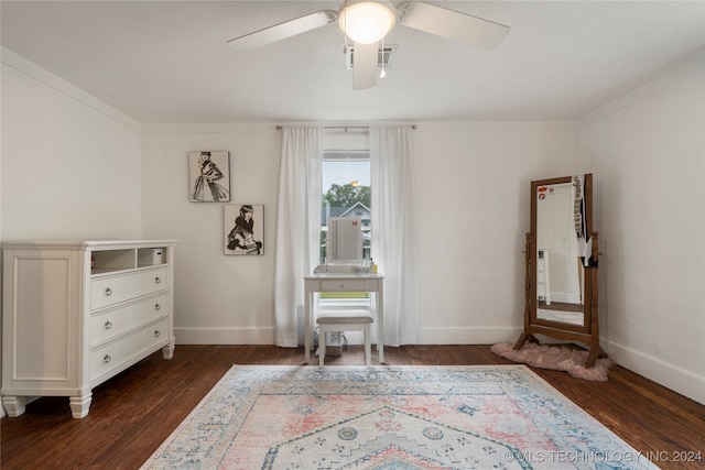 interior space featuring ceiling fan, dark hardwood / wood-style floors, and crown molding