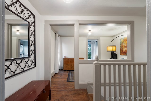 corridor featuring dark hardwood / wood-style floors