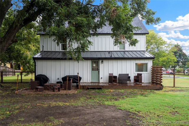 rear view of house with a yard