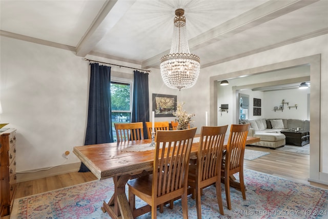 dining room with crown molding, light hardwood / wood-style floors, beamed ceiling, and a notable chandelier