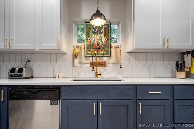 kitchen featuring decorative backsplash, white cabinets, pendant lighting, stainless steel dishwasher, and sink