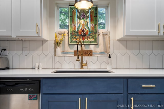 kitchen featuring blue cabinets, white cabinets, tasteful backsplash, and stainless steel dishwasher