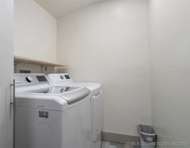 laundry room featuring washing machine and dryer