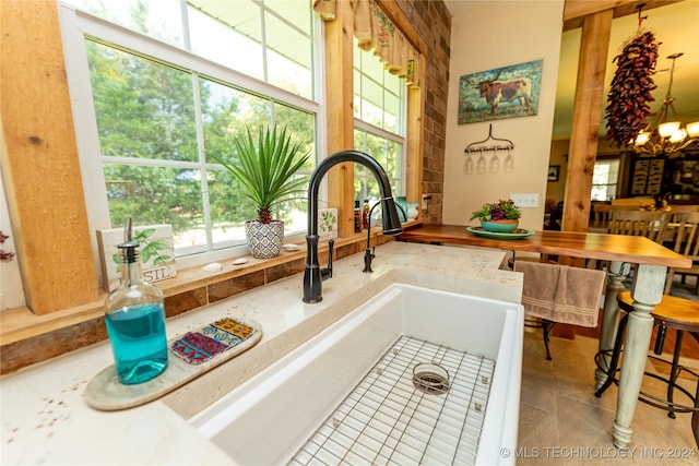 room details with a chandelier and light tile patterned flooring