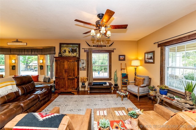 living room featuring ceiling fan, a textured ceiling, plenty of natural light, and hardwood / wood-style floors