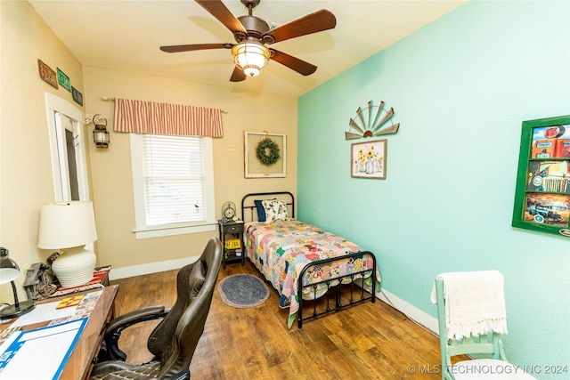 bedroom featuring ceiling fan and wood-type flooring