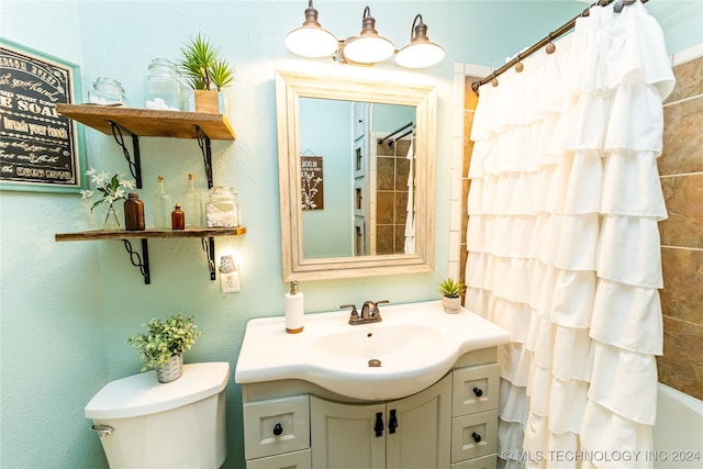 full bathroom with shower / tub combo, vanity, and toilet