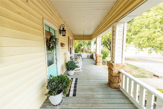 wooden deck with a porch