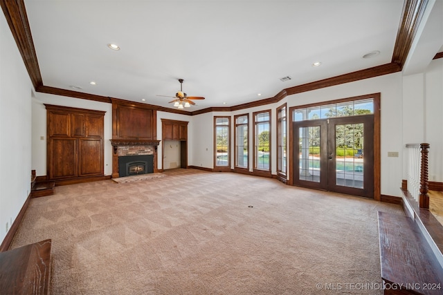 unfurnished living room featuring ceiling fan, light colored carpet, and crown molding