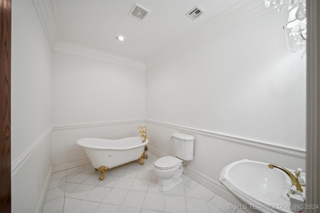 bathroom with a bathing tub, crown molding, toilet, sink, and tile patterned floors