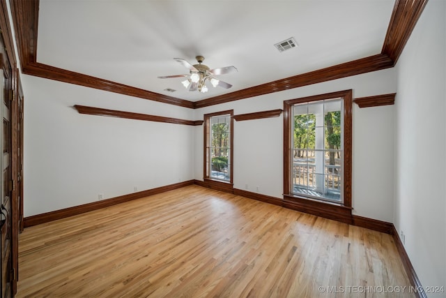 spare room with ceiling fan, light hardwood / wood-style flooring, and crown molding