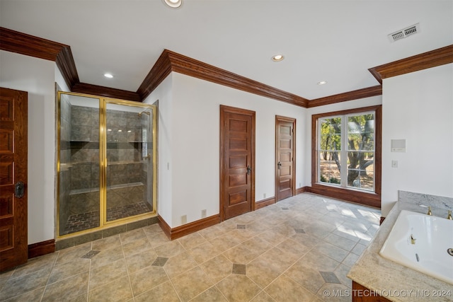 bathroom with plus walk in shower, crown molding, and sink