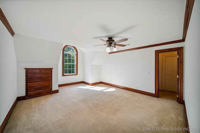 bonus room with ceiling fan, lofted ceiling, and light carpet