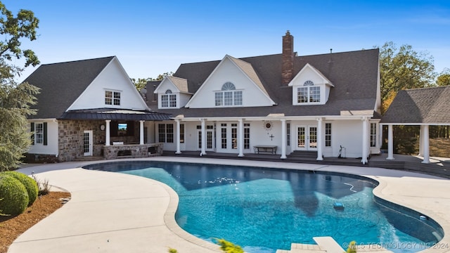 back of house with french doors and a patio area