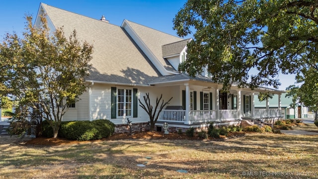 back of house with a porch