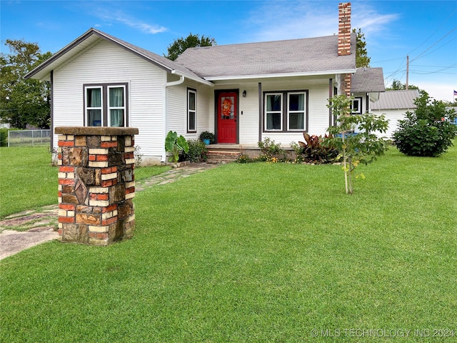 ranch-style house with a front yard