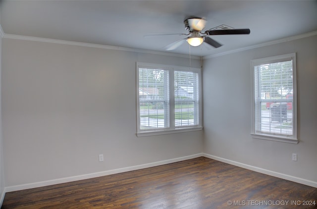 empty room featuring dark hardwood / wood-style flooring, ceiling fan, and crown molding