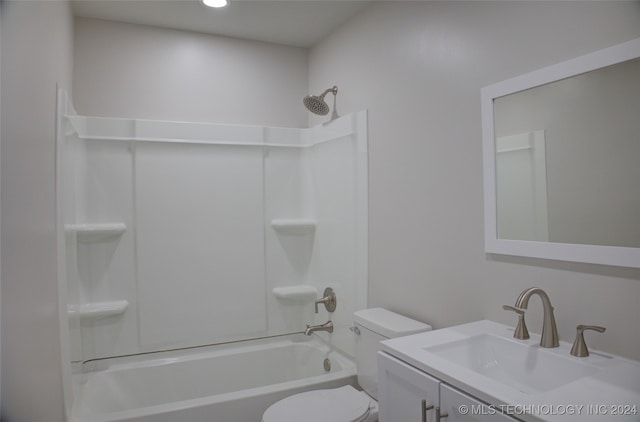 full bathroom featuring vanity, bathing tub / shower combination, and toilet