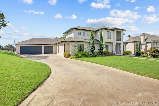 view of front facade with a front yard and a garage