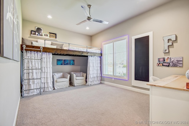 bedroom with ceiling fan and light colored carpet