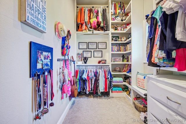 walk in closet featuring carpet