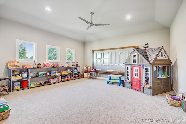 game room with lofted ceiling, ceiling fan, and carpet flooring