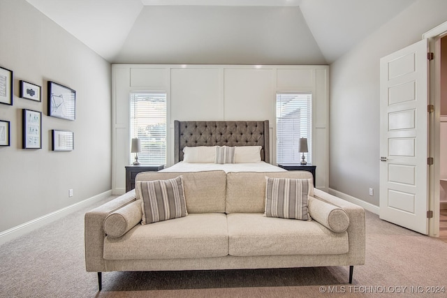 carpeted bedroom featuring lofted ceiling