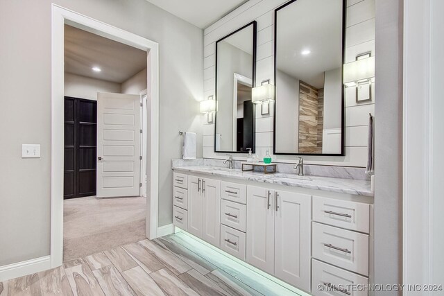 bathroom with hardwood / wood-style floors and vanity