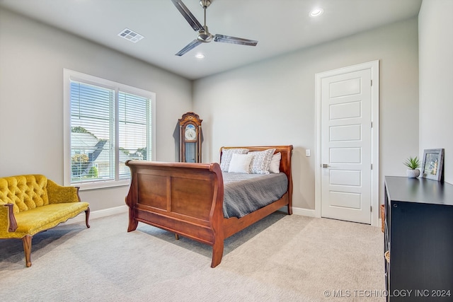 bedroom with ceiling fan and light colored carpet