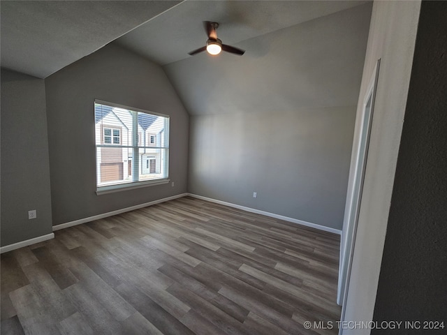 bonus room featuring vaulted ceiling, hardwood / wood-style floors, and ceiling fan