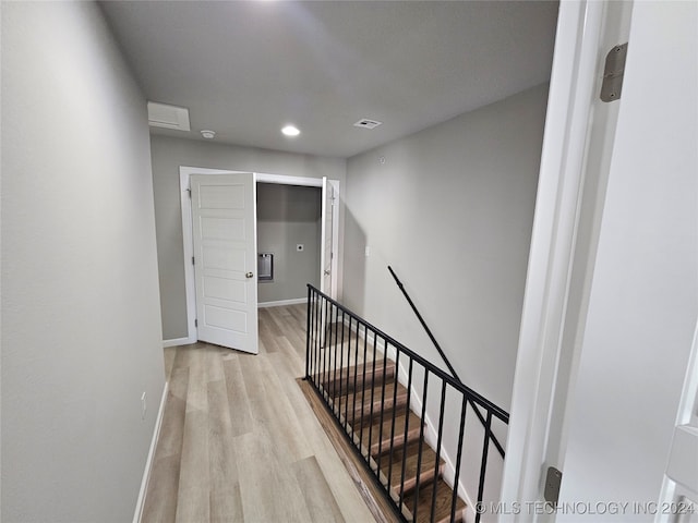 stairway featuring hardwood / wood-style flooring