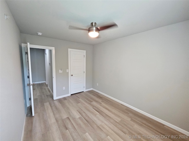 unfurnished bedroom with light hardwood / wood-style floors and ceiling fan