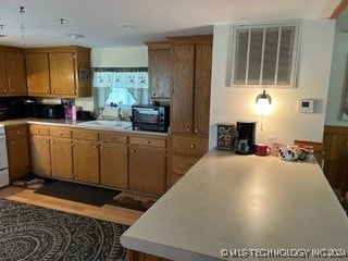 kitchen featuring kitchen peninsula and sink