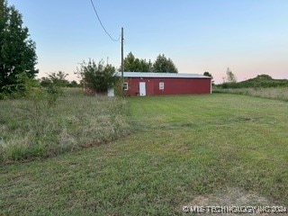 view of yard with a rural view