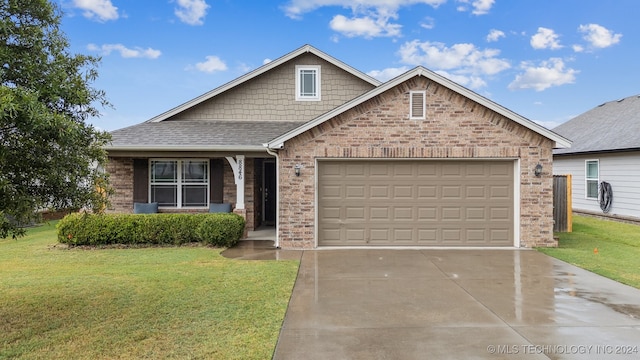 view of front of house with a front lawn and a garage