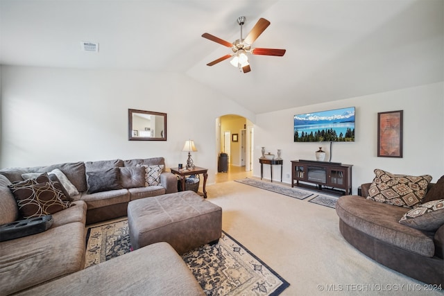 carpeted living room featuring vaulted ceiling and ceiling fan