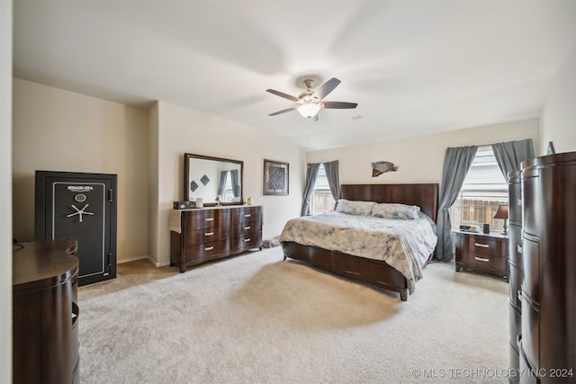 bedroom with light carpet and ceiling fan