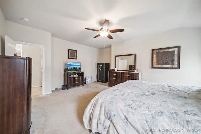 carpeted bedroom with ceiling fan and lofted ceiling