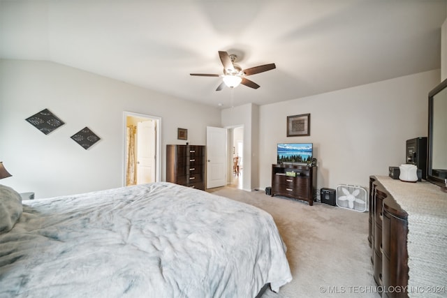 bedroom with lofted ceiling, ensuite bathroom, ceiling fan, and light colored carpet