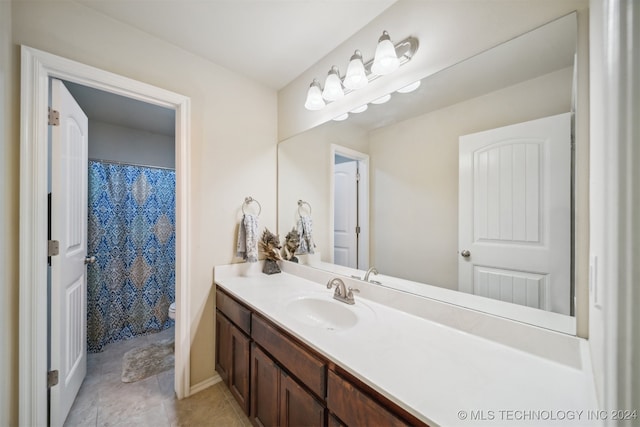 bathroom featuring vanity, tile patterned floors, toilet, and a shower with shower curtain