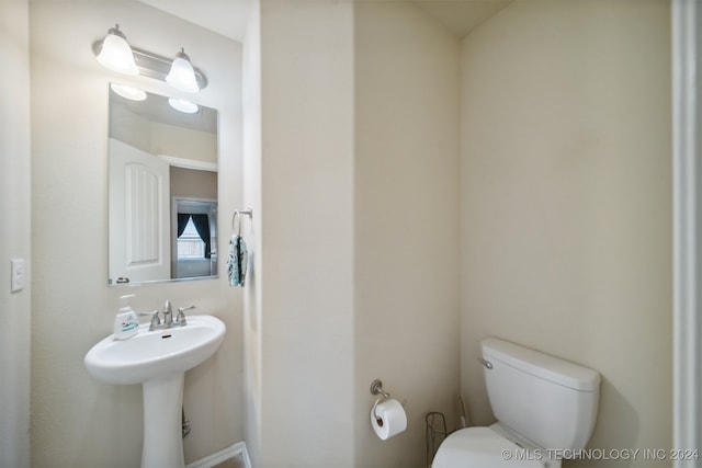 bathroom with sink and toilet