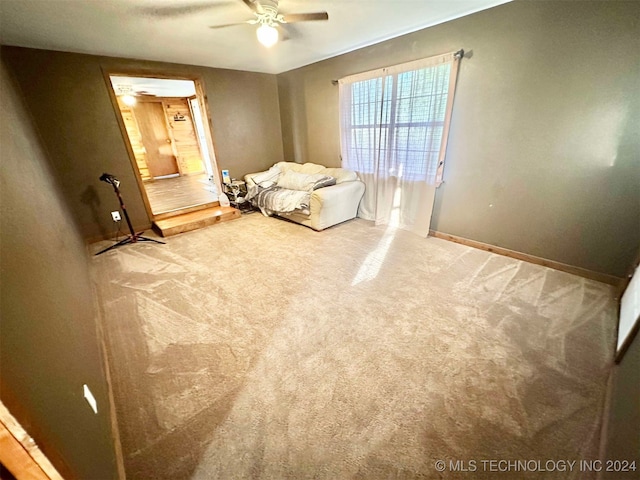 unfurnished bedroom with carpet floors and ceiling fan